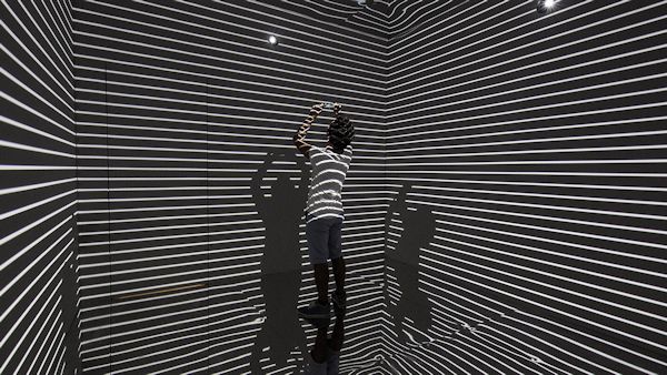 A person in the "Infinity Room" installation