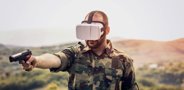 Soldier airming gun wearing VR headset