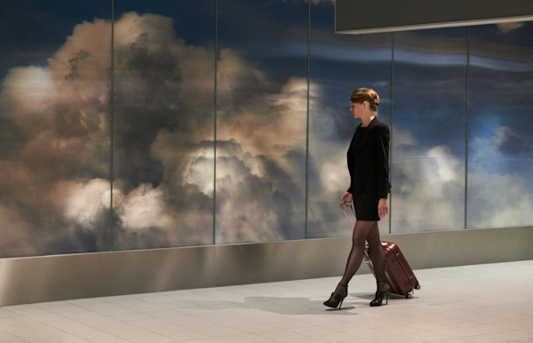 Woman walking by Beyond at Schiphol Airport