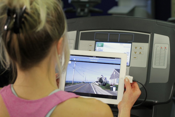 Outside Interactive - woman on treadmill with iPad