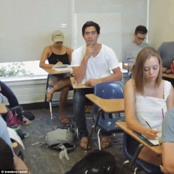Zach King hides in class behind photo of himself.
